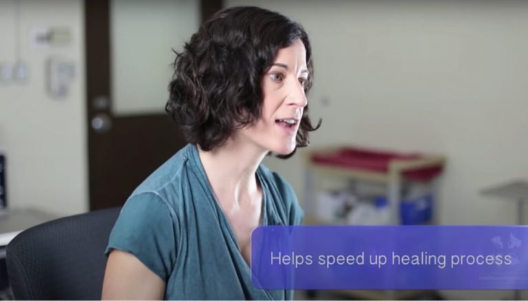 A female veterinarian discusses the benefits of laser therapy for dogs and cats