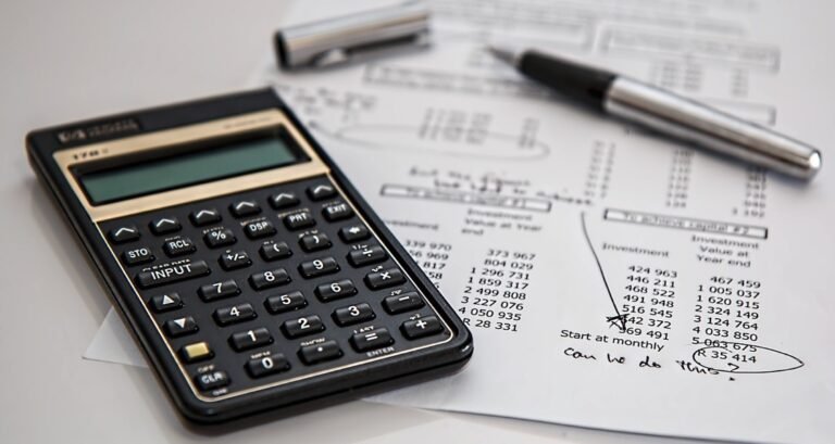 A calculator on top of a paper with numbers