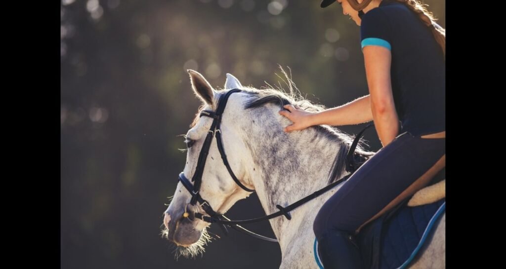 A girl is riding a horse