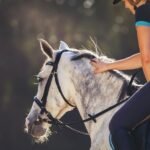 A girl is riding a horse
