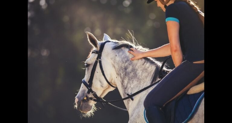 A girl is riding a horse