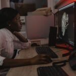 A woman is looking at scans of an animal